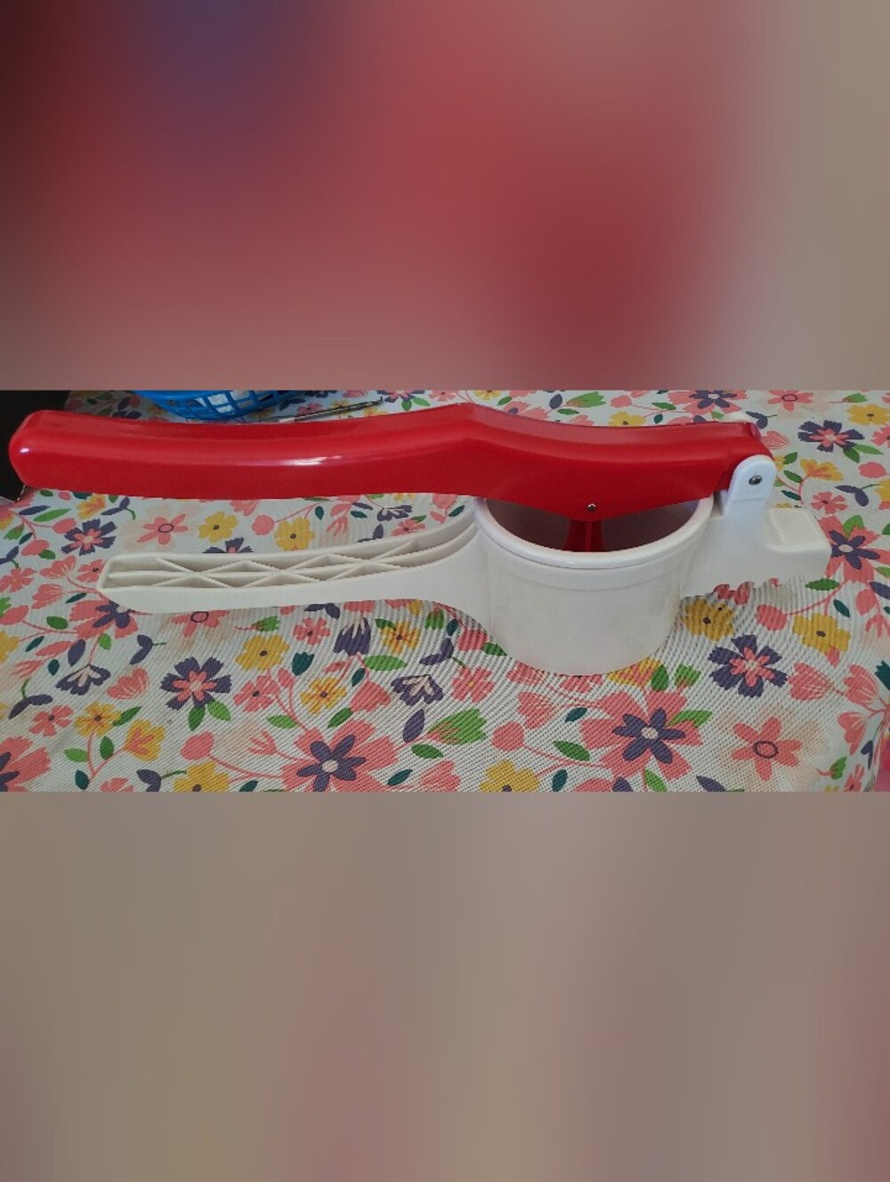 Red and White Handheld Potato Ricer